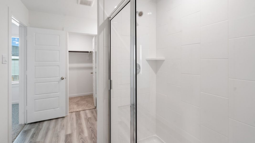 Representative furnished interior of a home built from the Jasmine by D.R. Horton in Grand West, Houston (Image 12).