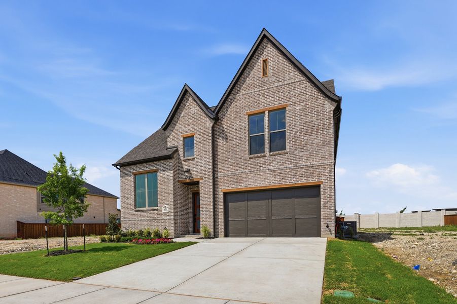 Front exterior of a new home in Hillside Village, Celina, TX, highlighting curb appeal (Image 23). Front exterior of a new home in Hillside Village, Celina, TX, highlighting curb appeal (Image 23).