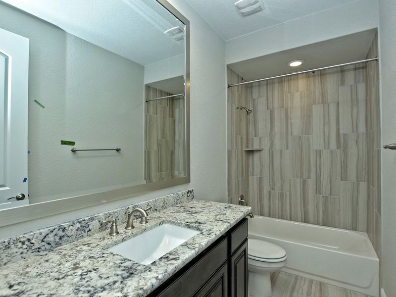 Representative furnished interior of a home built from the Madera II by Giddens Homes in Scofield Farms Estates, Georgetown (Image 203).