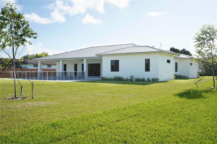 Front exterior of a new home in , Homestead, FL, highlighting curb appeal (Image 30).
