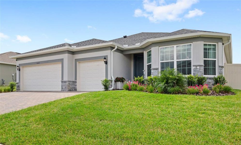 Front exterior of a new home in , Mount Dora, FL, highlighting curb appeal (Image 1).