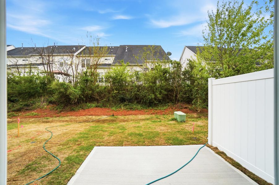 Exterior details and patio area of a home in Harrisburg Village Townhomes, Harrisburg (Image 25).
