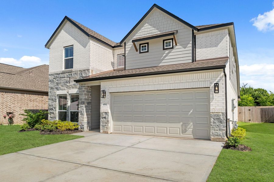 Front exterior of a new home in Grand Oaks – The Cove, Houston, TX, highlighting curb appeal (Image 14). Front exterior of a new home in Grand Oaks – The Cove, Houston, TX, highlighting curb appeal (Image 14).