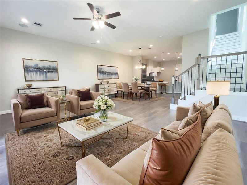 The living room in the ROClake home features a spacious, open-concept layout with a clean and modern design. The ROClake's living room offers a modern and inviting space that is both functional and aesthetically pleasing, ideal for both relaxing and entertaining. Image is virtually staged.