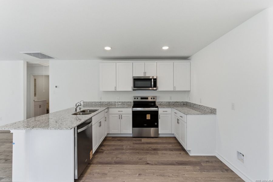 Furnished interior view inside a new home in Cinco Lakes, San Antonio (Image 3).