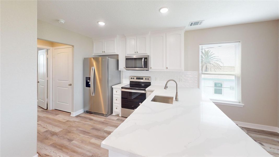 Quartz countertops in the Kitchen and Bathrooms Quartz countertops in the Kitchen and Bathrooms