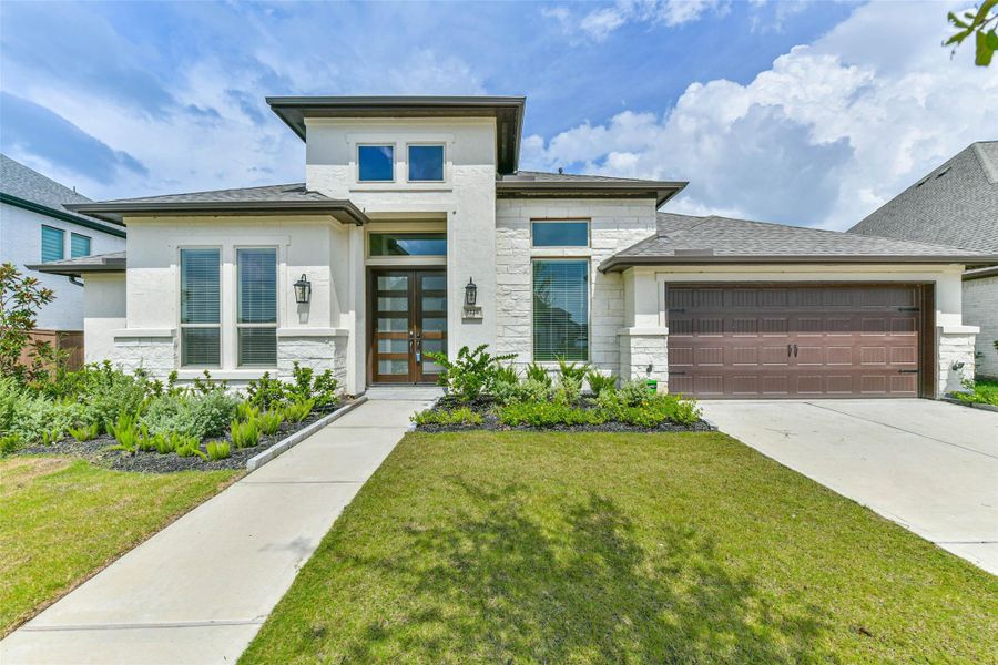 Front exterior of a new home in , Manvel, TX, highlighting curb appeal (Image 24). Front exterior of a new home in , Manvel, TX, highlighting curb appeal (Image 24).
