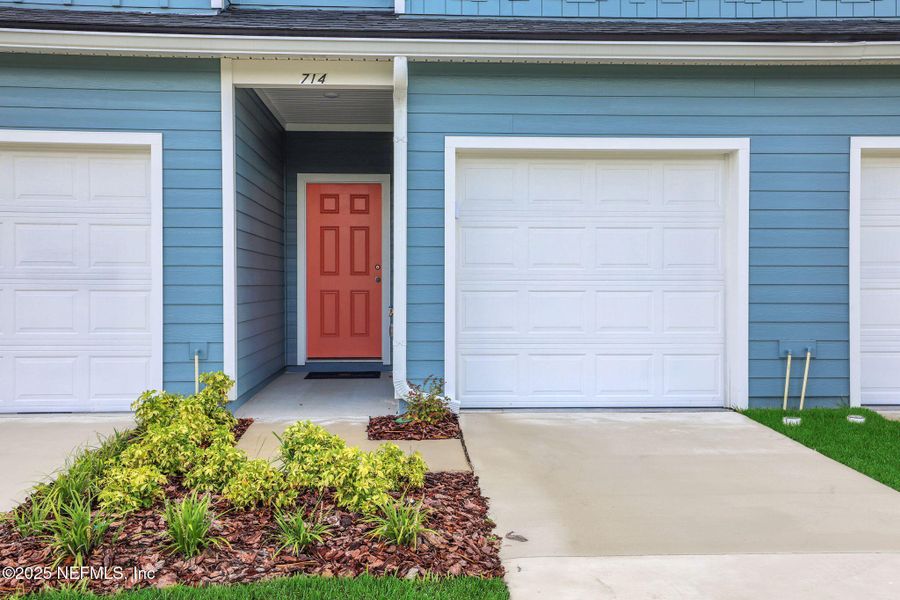Front exterior of a new home in Kasen Oaks, Jacksonville, FL, highlighting curb appeal (Image 17).