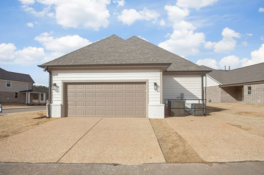 Front exterior of a new home in Twin Oaks, Oakland, TN, highlighting curb appeal (Image 26). Front exterior of a new home in Twin Oaks, Oakland, TN, highlighting curb appeal (Image 26).