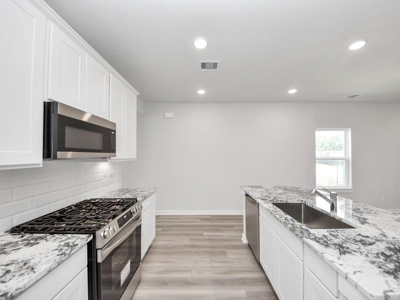 Furnished interior view inside a new home in Windmill Estates, Magnolia (Image 8).