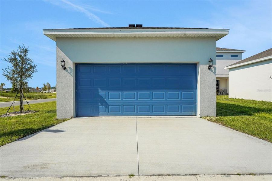 Front exterior of a new home in Crossroads at Kelly Park, Apopka, FL, highlighting curb appeal (Image 18).