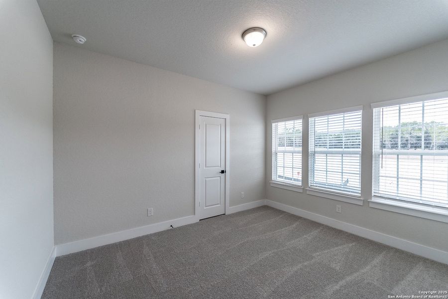 Spacious, unfurnished interior of a new home in The Woodlands at Medina Hills, Mico (Image 13).