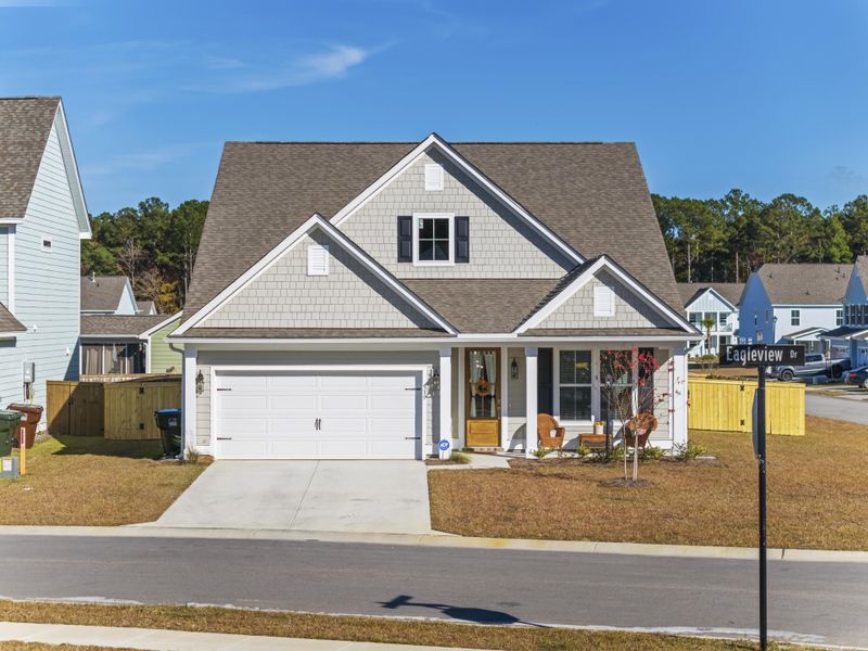 Front exterior of a new home in High Point at Foxbank, Moncks Corner, SC, highlighting curb appeal (Image 1).