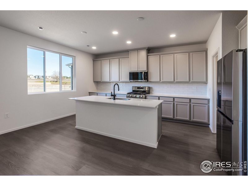 Furnished interior view inside a new home in Bloom Trailblazer Collection - Single Family Homes, Fort Collins (Image 12).