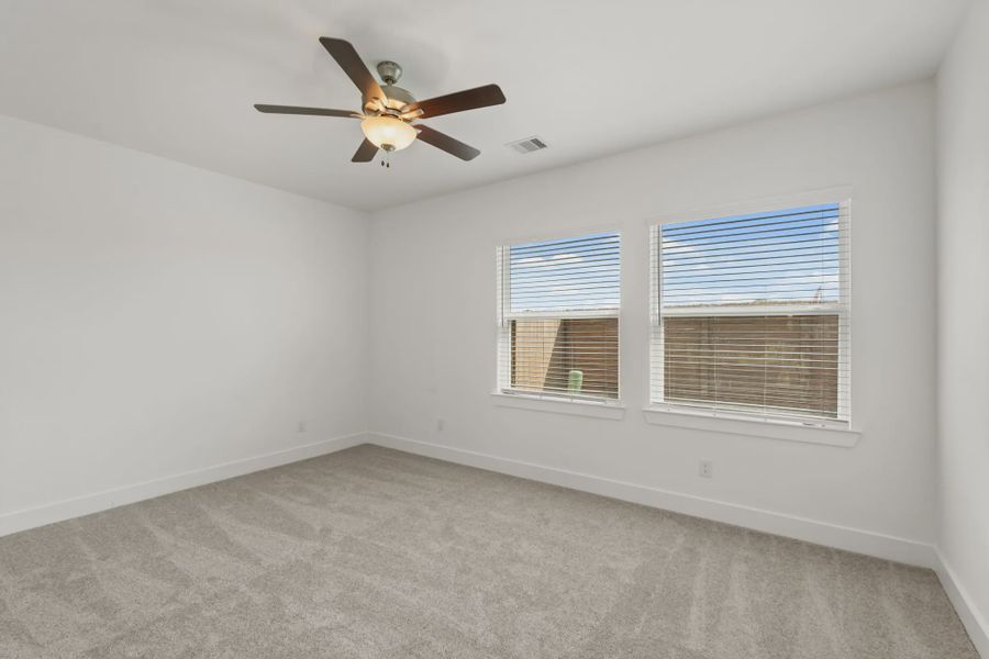 Representative unfurnished interior of a home built from the Chalet by Chesmar Homes in Meridiana Townhomes, Iowa Colony (Image 34).