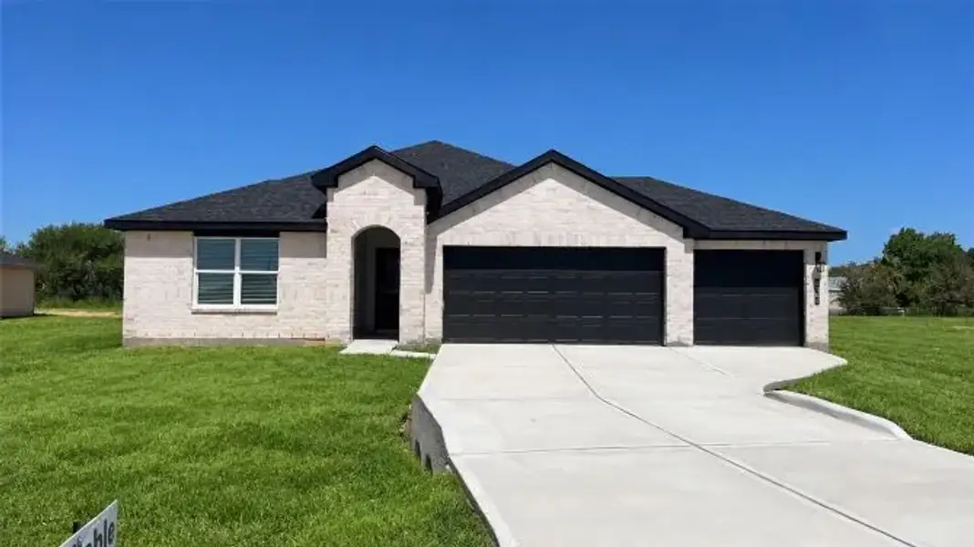Front exterior of a new home in Blue Heron Estates, Beasley, TX, highlighting curb appeal (Image 1). Front exterior of a new home in Blue Heron Estates, Beasley, TX, highlighting curb appeal (Image 1).