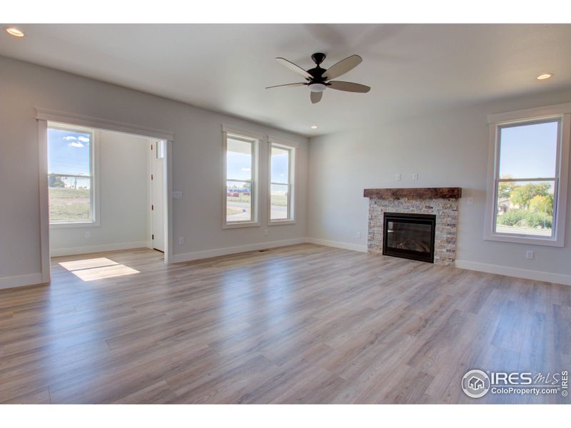 The front entry with a coat closet and drop zone opens to the living room