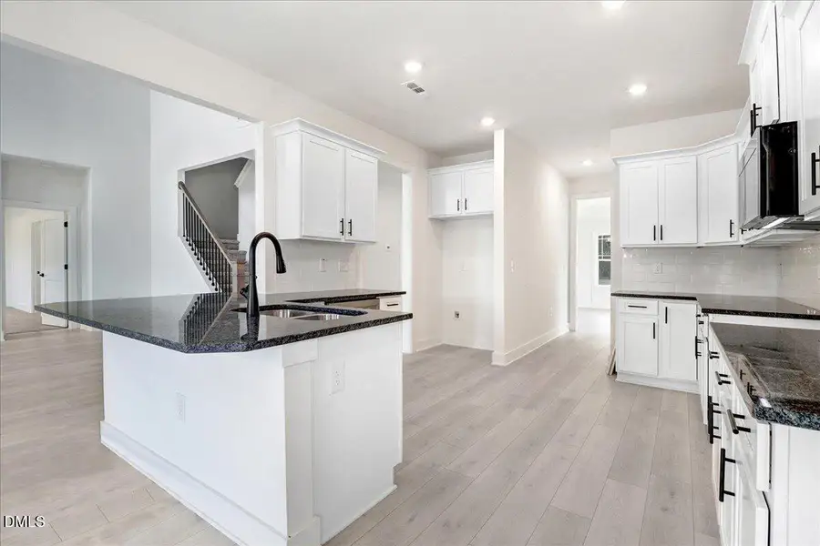 Furnished interior view inside a new home in Hidden Pines, Cameron (Image 4).