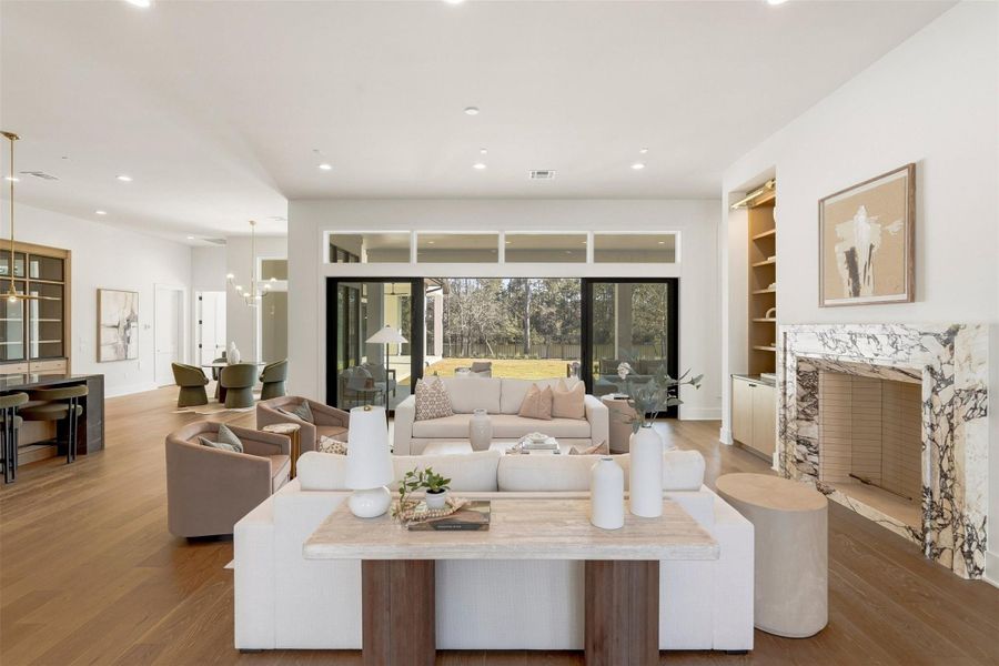Expansive sliding glass doors open up the space to fresh air and sweeping, unobstructed water views. The front-of-the house kitchen is seamlessly to your left. Notice the breakfast nook in the distance. Closed door is a full bathroom with a walk-in shower. Beyond, an open doorway reveals the first-floor game room. Expansive sliding glass doors open up the space to fresh air and sweeping, unobstructed water views. The front-of-the house kitchen is seamlessly to your left. Notice the breakfast nook in the distance. Closed door is a full bathroom with a walk-in shower. Beyond, an open doorway reveals the first-floor game room.
