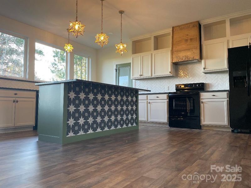 Beautifully designed with each feature complimenting another - particularly the custom-built hood over the range.