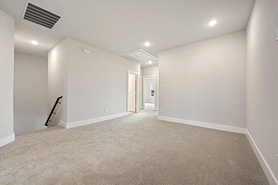 The upstairs game room provides a spacious second family living space.