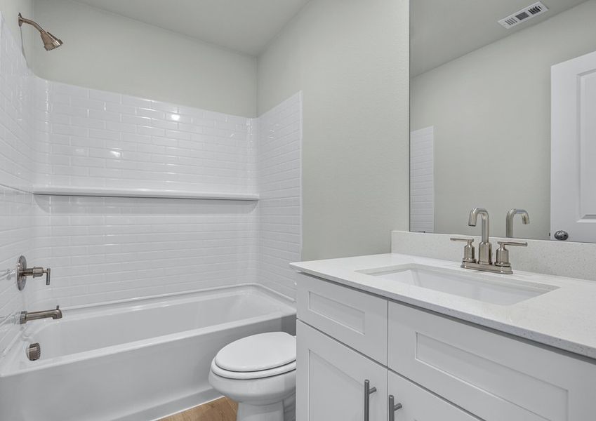 Secondary bath has white cabinets and shower/tub combo. Secondary bath has white cabinets and shower/tub combo.