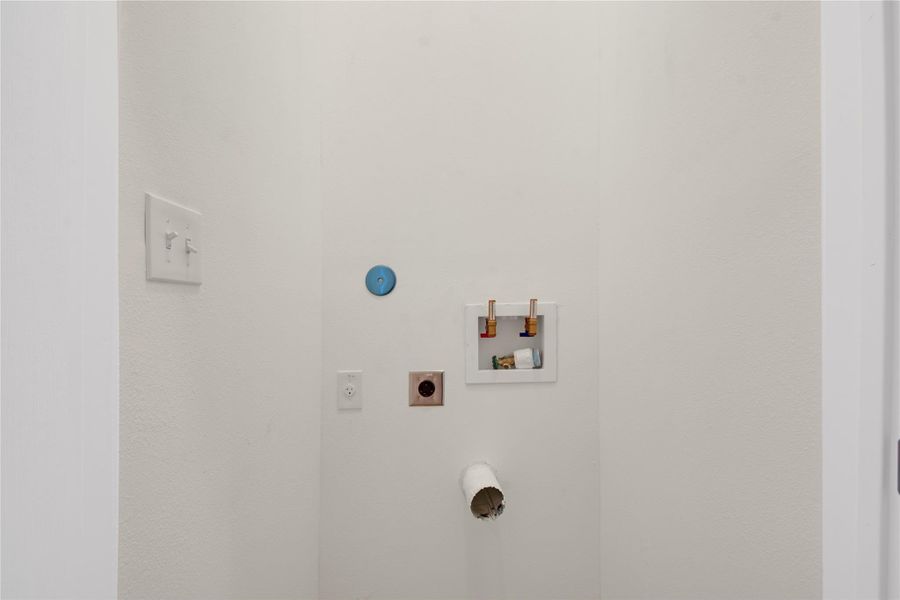 Laundry room featuring electric dryer hookup and washer hookup