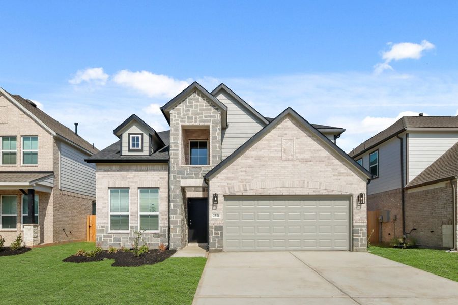 Front exterior of a new home in Barton Creek Ranch, Conroe, TX, highlighting curb appeal (Image 2). Front exterior of a new home in Barton Creek Ranch, Conroe, TX, highlighting curb appeal (Image 2).