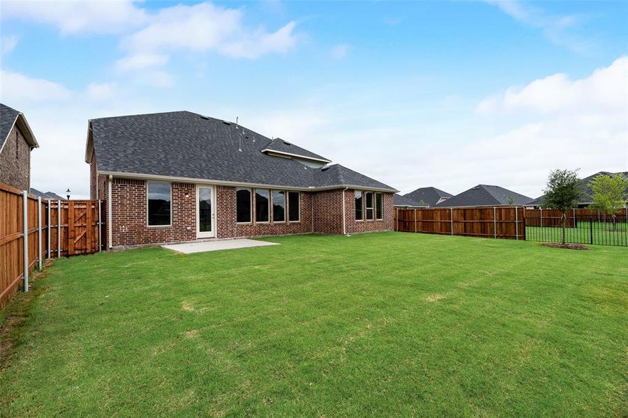 Front exterior of a new home in Valencia On The Lake, Little Elm, TX, highlighting curb appeal (Image 16).