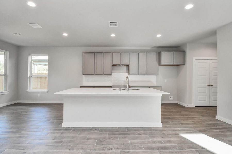 Another perspective of the spacious kitchen! Sample photo of completed home with similar floor plan. Actual colors and selections may vary. Another perspective of the spacious kitchen! Sample photo of completed home with similar floor plan. Actual colors and selections may vary.