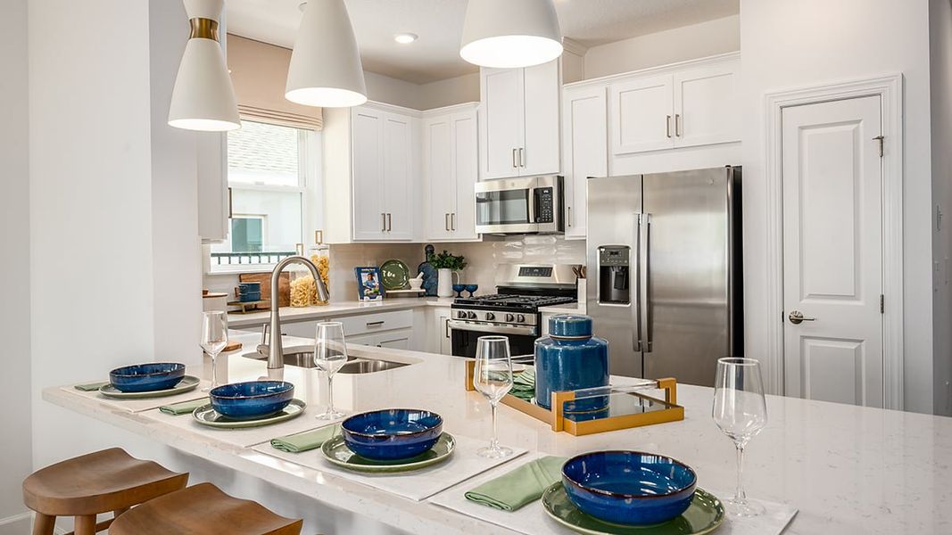 Representative furnished interior of a home built from the Caicos by Taylor Morrison in Esplanade at McKinnon Groves, Winter Garden (Image 5).