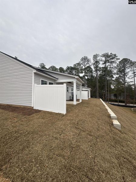 Exterior details and patio area of a home in Piney Woods Bluff, Columbia (Image 18).