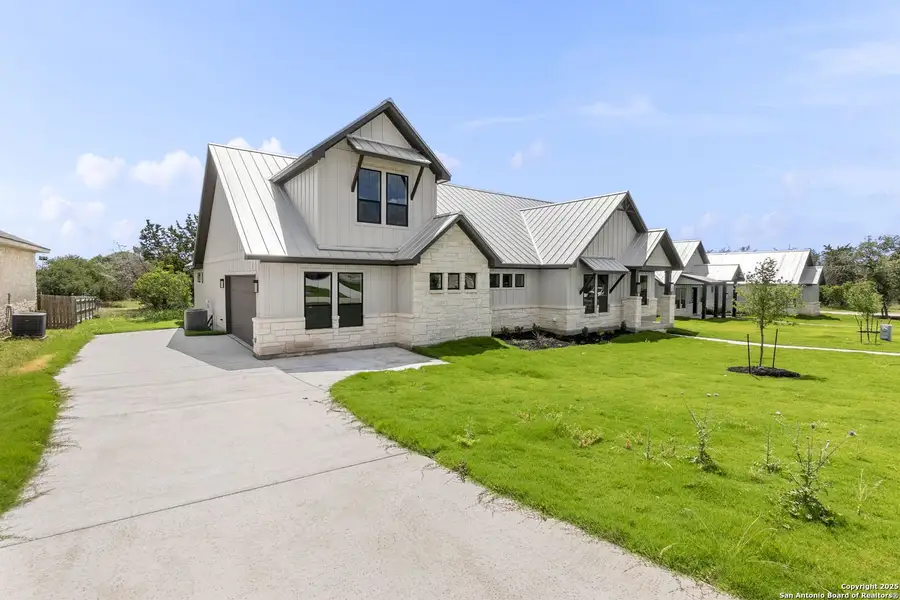 Front exterior of a new home in , Wimberley, TX, highlighting curb appeal (Image 11).
