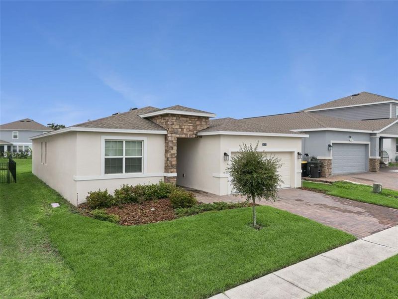 Front exterior of a new home in , Davenport, FL, highlighting curb appeal (Image 27). Front exterior of a new home in , Davenport, FL, highlighting curb appeal (Image 27).