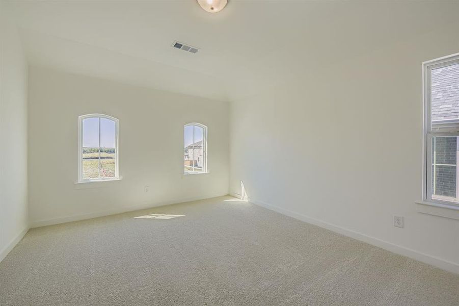 Spare room with carpet floors and baseboards