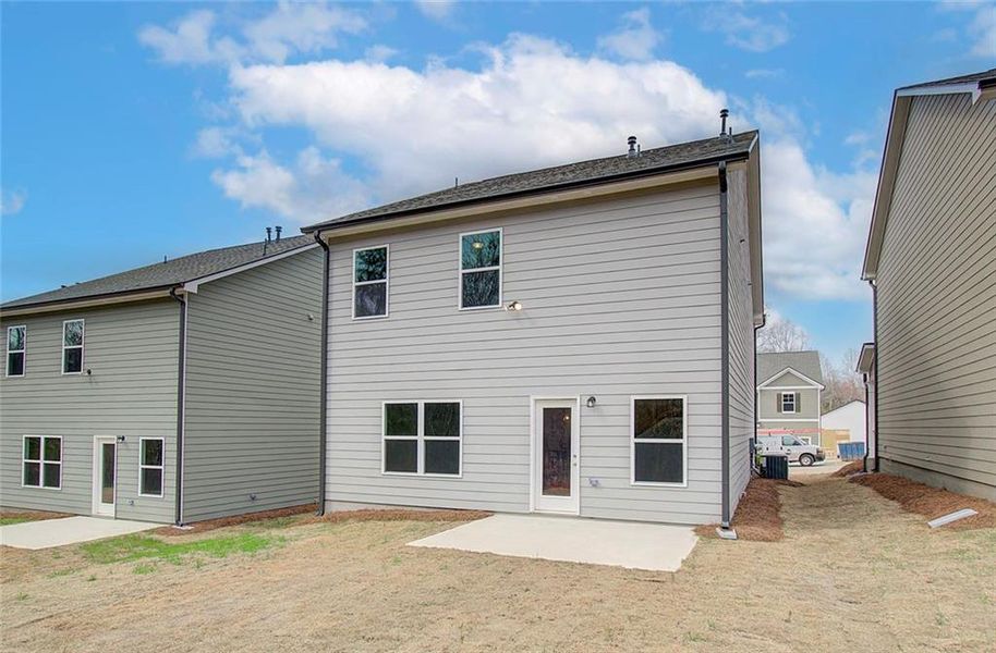 Front exterior of a new home in Kentmere, Auburn, GA, highlighting curb appeal (Image 1).