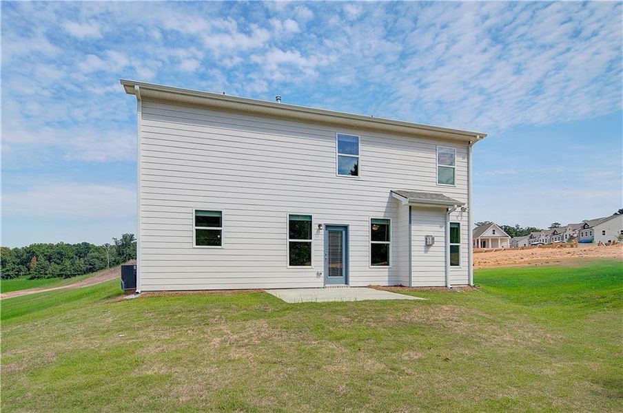 Front exterior of a new home in Abbotts Crossing, Conyers, GA, highlighting curb appeal (Image 13).