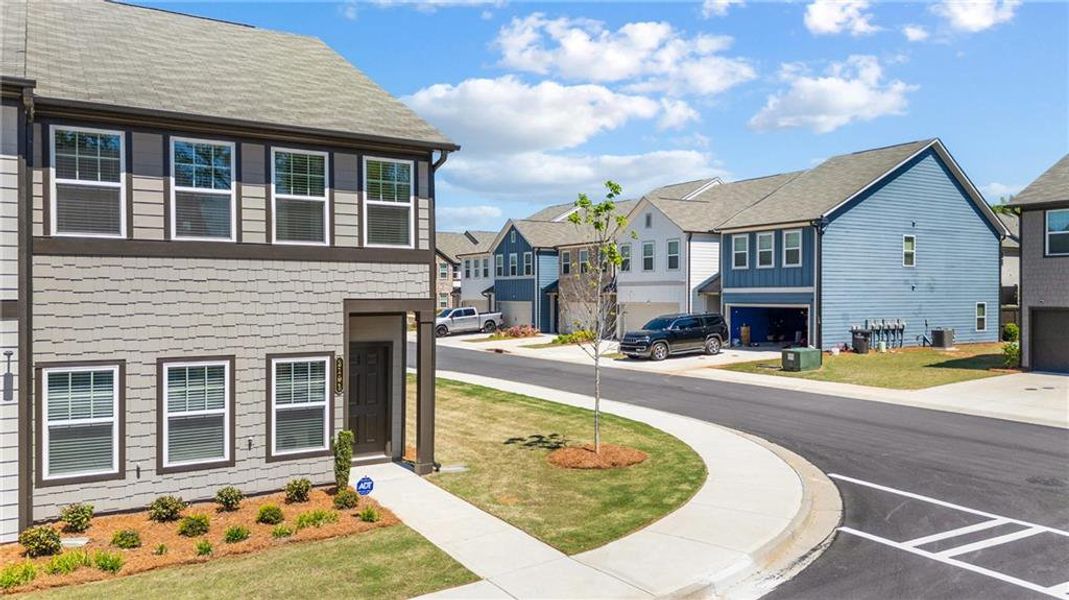 Front exterior of a new home in Laurelwood, Douglasville, GA, highlighting curb appeal (Image 29).