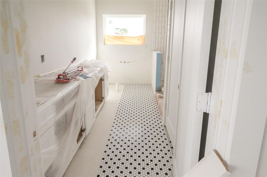 The primary bathroom is coming together with unique tile work and installed cabinets. The primary bathroom is coming together with unique tile work and installed cabinets.