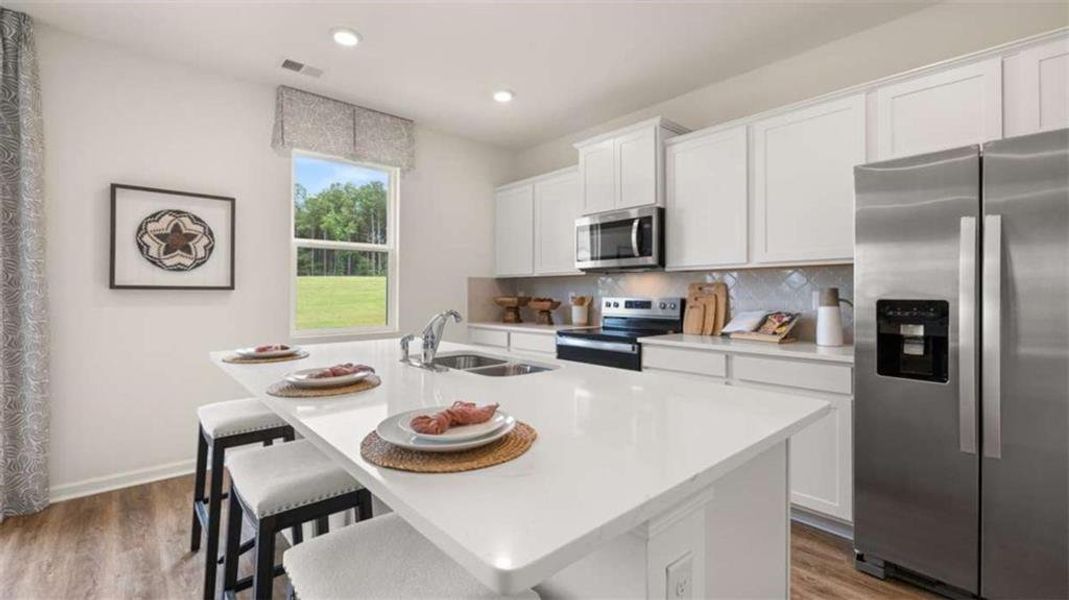 Furnished interior view inside a new home in Oakchase at Hampton, Hampton (Image 32).