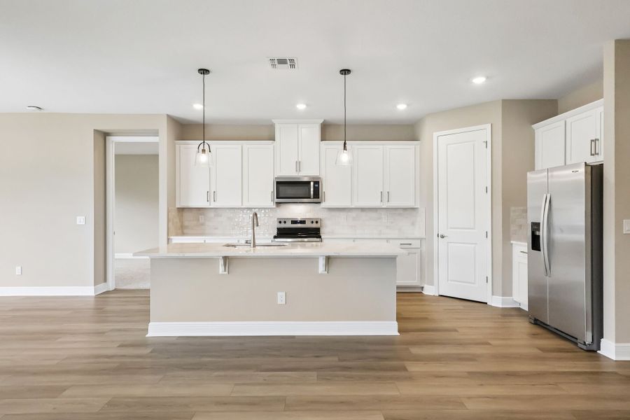 Furnished interior view inside a new home in Legends Preserve - Signature Series, Daytona Beach (Image 3).