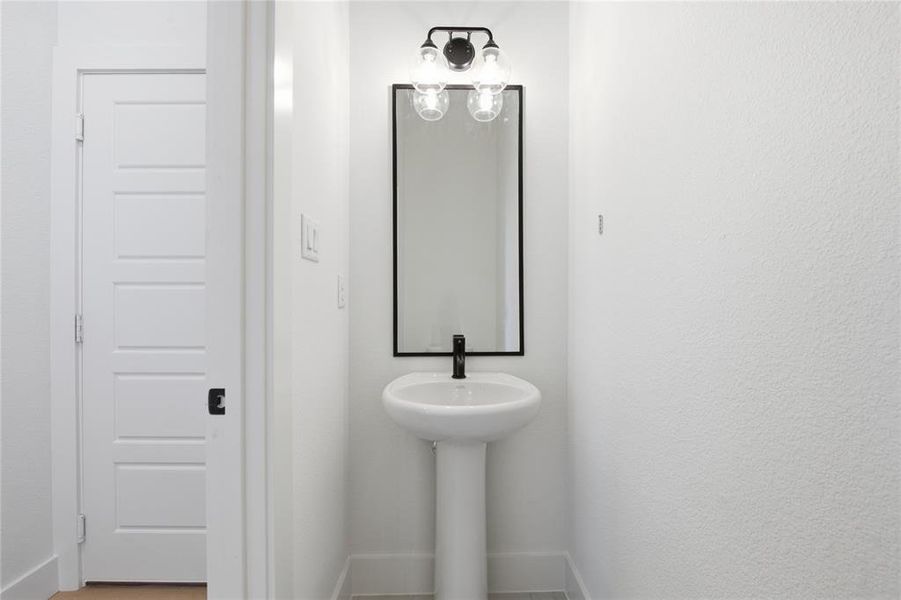 Bathroom featuring baseboards Bathroom featuring baseboards