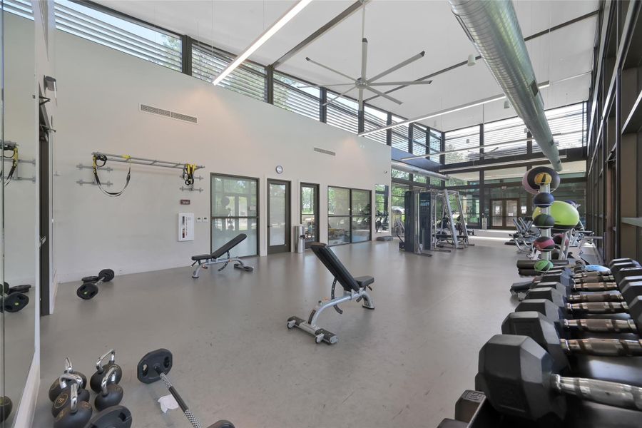 State-of-the-art community fitness center featuring a dedicated children’s room and a separate virtual coach training room.