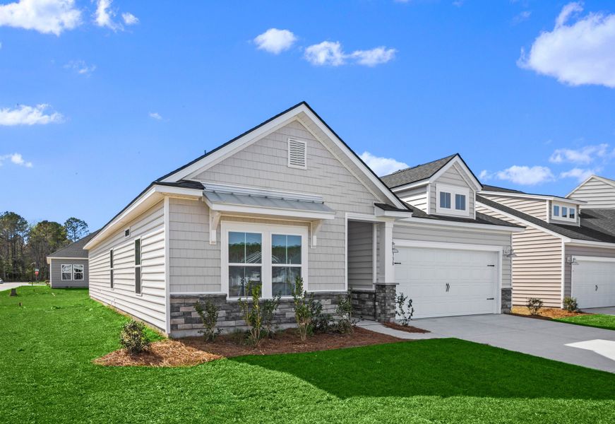 Front exterior of a new home in Wood Stork Landing, Ocean Isle Beach, NC, highlighting curb appeal (Image 1). Front exterior of a new home in Wood Stork Landing, Ocean Isle Beach, NC, highlighting curb appeal (Image 1).