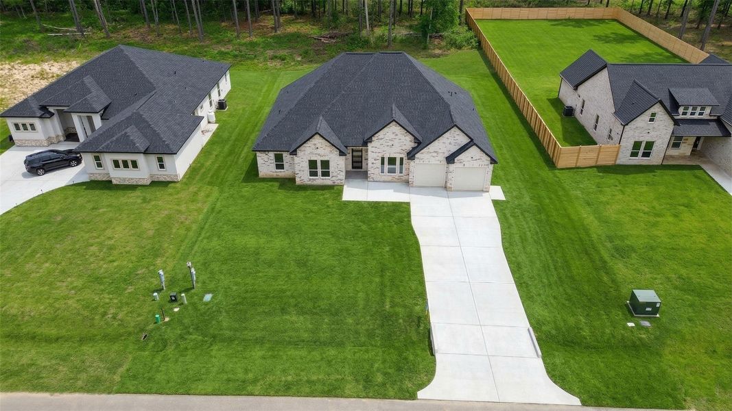 Front exterior of a new home in , Dayton, TX, highlighting curb appeal (Image 19). Front exterior of a new home in , Dayton, TX, highlighting curb appeal (Image 19).