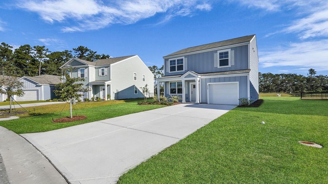 Front exterior of a new home in Hillcrest, Ravenel, SC, highlighting curb appeal (Image 23). Front exterior of a new home in Hillcrest, Ravenel, SC, highlighting curb appeal (Image 23).