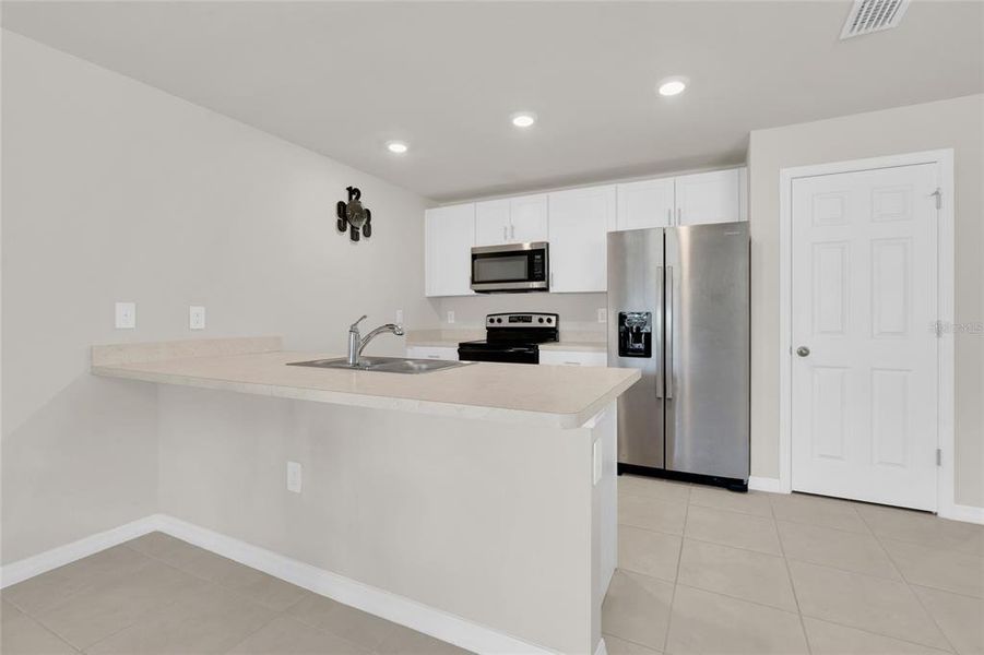Furnished interior view inside a new home in , Port Charlotte (Image 17). Furnished interior view inside a new home in , Port Charlotte (Image 17).