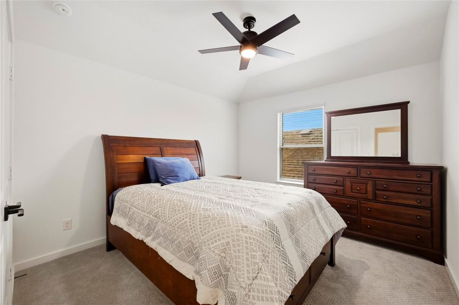 A graceful tray ceiling adds character to the third bedroom, while plush carpet flooring creates a warm, comfortable space that feels instantly inviting. A graceful tray ceiling adds character to the third bedroom, while plush carpet flooring creates a warm, comfortable space that feels instantly inviting.