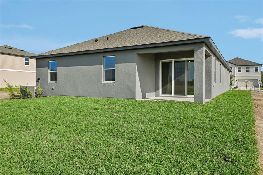 Exterior details and patio area of a home in Berry Bay, Wimauma (Image 14).