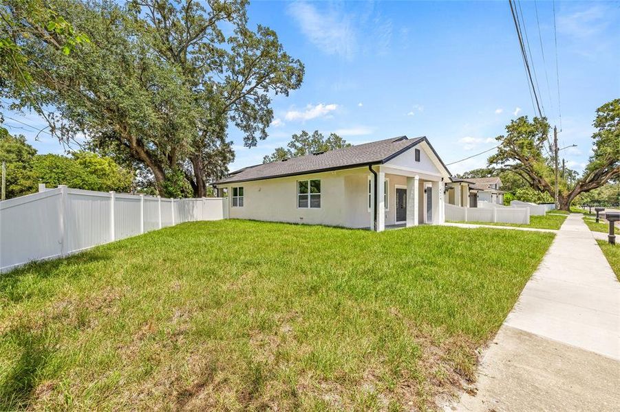 Front exterior of a new home in , Tampa, FL, highlighting curb appeal (Image 24).